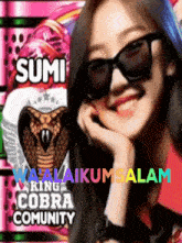 a woman wearing sunglasses is smiling in front of a sign that says sumi ring cobra community