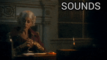 a woman sits at a desk with the words " sounds ridiculous but go on " below her