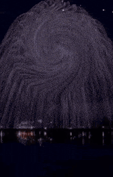 a painting of a swirl with a red white and blue circle in the middle