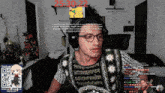 a man wearing headphones and a shirt that says 25 30 22 on the bottom