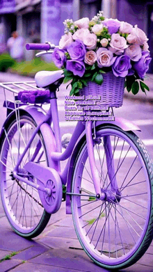 a purple bicycle with purple flowers in the basket