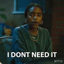 a woman sitting at a table with the words i dont need it written on the bottom
