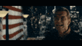 a man in a dark room with enough written on the screen