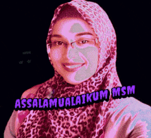 a woman wearing a leopard print scarf and glasses says assalamualaikam msm