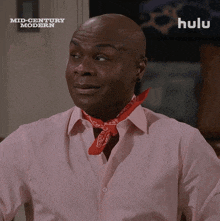 a man in a pink shirt with a red bandana around his neck is featured on hulu