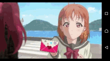 a pixel art of a girl holding a heart shaped envelope