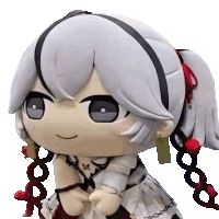 a stuffed toy of a girl with white hair and red earrings