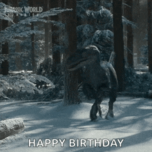 a dinosaur in a snowy forest with the words happy birthday