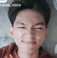 a close up of a person 's face with mirae_vlsco written in the corner
