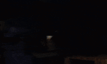 a cartoon drawing of a man holding a torch in a dark room