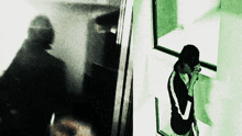 a man talking on a cell phone while looking out of a window