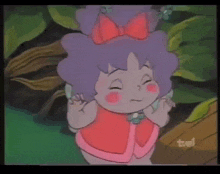 a cartoon girl with purple hair and a red bow on her head is on a tv screen