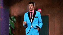 a man in a blue suit is smoking a cigarette