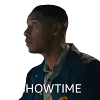 a man wearing a blue jacket with the word showtime on the bottom