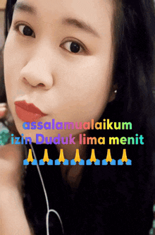 a close up of a woman 's face with the words " assalamualaikum izin duduk lima menit " below her