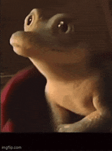 a close up of a stuffed animal with its mouth wide open