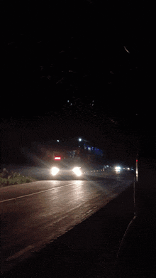 a blurry picture of a street at night