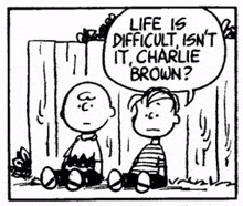 a black and white cartoon of charlie brown and snoopy sitting next to each other in front of a wooden fence .