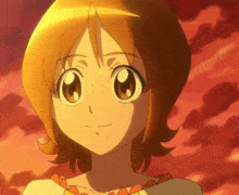 a close up of a girl with orange hair