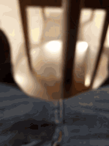 a blurry picture of a person 's legs and a table