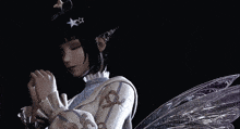 a girl with wings and a star on her hair