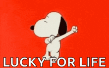 snoopy is dancing on a red background with the words " lucky for life " below him