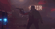 a man holding a gun in front of a sign that says technio