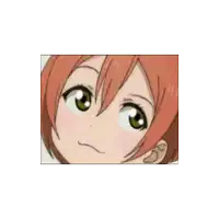 a close up of a cartoon girl 's face with red hair and green eyes .
