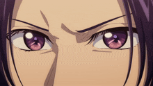 a close up of a person 's eyes with a purple pupil