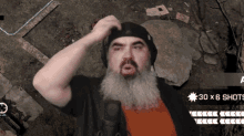 a man with a beard is playing a video game and has 30 x 6 shots on his screen