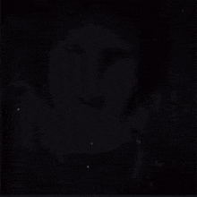a black and white photo of a woman with her mouth open
