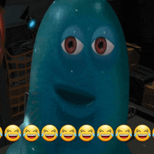 a blue cartoon character is surrounded by laughing and crying smiley faces