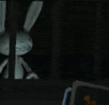 a blurry picture of a person in a dark room .