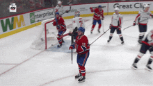 a hockey game is being played in front of advertisements for enterprise and great clip
