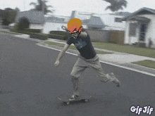 a gif of a person riding a skateboard with a helmet on their head