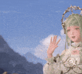 a girl with green hair and a crown on her head is waving her hand