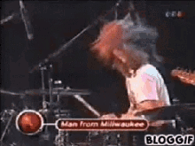 a man from milwaukee is playing the drums