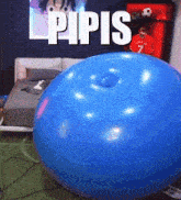 a blue balloon in a room with the word pipis above it