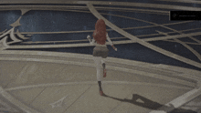 a screenshot of a video game shows a woman running in a circle