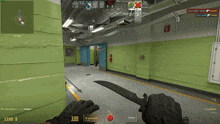 a person is holding a knife in a video game with the number 100 on the screen