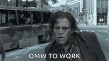 a zombie is walking down a street in front of a bus .