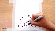 someone is drawing a polar bear with a sharpie