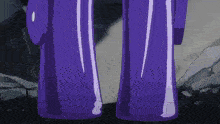 two purple bottles are standing next to each other on a rock