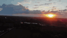 an aerial view of a sunset over a valley