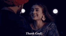 a man and a woman are looking at each other and the woman is saying thank god