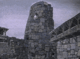 a cartoon drawing of a castle with a stone tower in the foreground