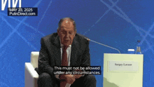 a man in a suit and tie is sitting in front of a podium with the name sergey lavrov on it