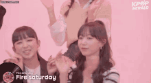 a group of girls are sitting in front of a pink background with the words fire saturday