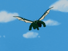 a green dragon with wings and horns is flying through the air