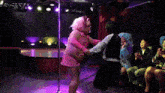 a man in a kappa jacket is dancing with another man